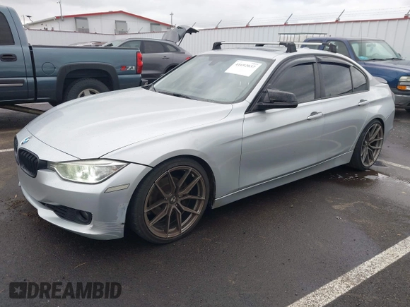 2014 BMW 3 Series 328i with VIN WBA3C1C58EK105766, listed as a IAAI auction lot 41692037 with 156,038 mi miles. Bid and sale history available at carsss.com. Image 2.