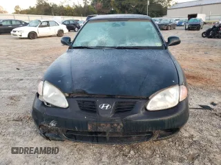 2000 Hyundai Elantra GLS z VIN KMHJF35F6YU890800, wystawiony jako Copart lot #76972294 z przebiegiem 159 134 mil mil oraz Szkoda całkowita • Salvage title. Historia ofert i sprzedaży dostępna na DreamBid. Obrazek 5.