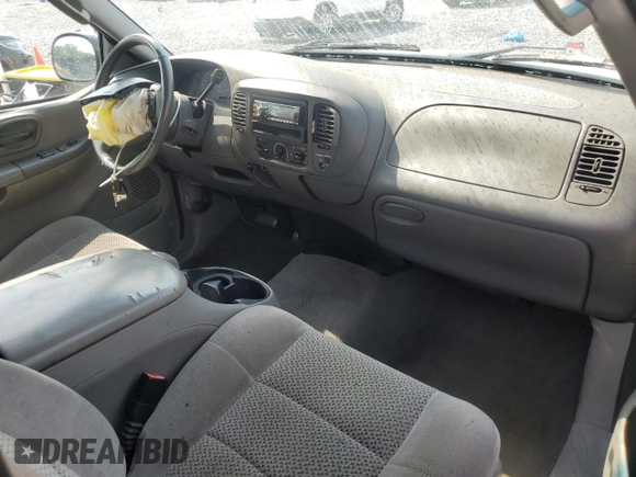 2002 Ford F-150 XL with VIN 1FTRX17272NB01218, listed as a Copart auction lot 61336795 with 201,972 mi miles and Salvage title. Bid and sale history available at DreamBid. Image 8.