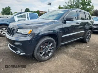 2015 Jeep Grand Cherokee Summit with VIN 1C4RJFJT8FC932597, listed as a Copart auction lot 64003325 with 146,882 mi miles and Clean title. Bid and sale history available at DreamBid. Image 1.