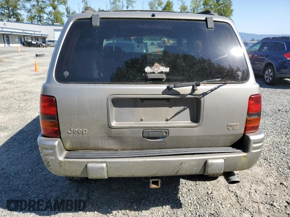1998 Jeep Grand Cherokee Limited z VIN 1J4GZ88Z1WC231772, wystawiony jako Copart lot #55697775 z przebiegiem 178 896 mil mil oraz Czysty tytuł • Clean title. Historia ofert i sprzedaży dostępna na DreamBid. Obrazek 6.