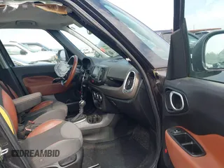 2014 FIAT 500L Trekking z VIN ZFBCFADH8EZ008208, wystawiony jako IAAI lot #42091284 z przebiegiem 79 407 mil mil oraz . Historia ofert i sprzedaży dostępna na DreamBid. Obrazek 5.