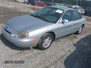1997 Ford Taurus GL z VIN 1FALP52U9VA295404, wystawiony jako IAAI lot #42234839 z przebiegiem 163 080 mil mil oraz . Historia ofert i sprzedaży dostępna na DreamBid. Obrazek 2.