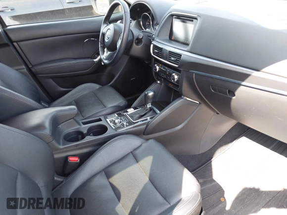 2016 Mazda CX-5 Grand Touring with VIN JM3KE4DY8G0639570, listed as a IAAI auction lot 42098512 with 126,541 mi miles and . Bid and sale history available at carsss.com. Image 5.
