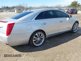 2013 Cadillac XTS Luxury with VIN 2G61R5S34D9233991, listed as a IAAI auction lot 41825533 with 152,706 mi miles. Bid and sale history available at carsss.com. Image 4.