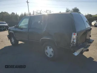1996 GMC Yukon with VIN 1GKEK13R1TJ741714, listed as a Copart auction lot 46814635 with 406,969 mi miles and Salvage Title. Bid and sale history available at carsss.com. Image 2.