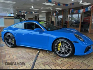 2022 Porsche 911 Carrera z VIN WP0AA2A96NS2061XX, wystawiony jako Copart lot #61761515 z przebiegiem 15 219 mil mil oraz Czysty tytuł • Clean title. Historia ofert i sprzedaży dostępna na DreamBid. Obrazek 1.