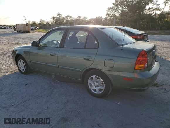 2005 Hyundai Accent GLS with VIN KMHCG45C35U595666, listed as a Copart auction lot 88294365 with 70,497 mi miles and Salvage Title. Bid and sale history available at carsss.com. Image 2.