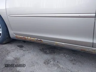 2003 Toyota Camry LE z VIN 4T1BF32K03U562089, wystawiony jako IAAI lot #42213639 z przebiegiem 281 054 mil mil oraz . Historia ofert i sprzedaży dostępna na DreamBid. Obrazek 14.