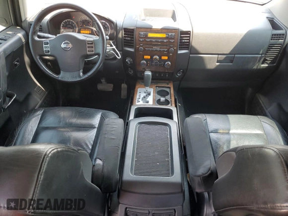 2011 Nissan Titan SL with VIN 1N6AA0EC4BN305296, listed as a Copart auction lot 59001395 with 194,557 mi miles and Salvage title. Bid and sale history available at DreamBid. Image 8.