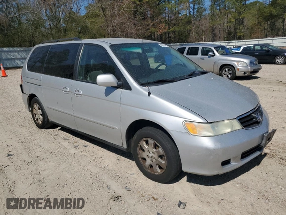 2004 Honda Odyssey EX-L with VIN 5FNRL18974B074613, listed as a Copart auction lot 48924865 with 212,633 mi miles and Salvage Title. Bid and sale history available at DreamBid. Image 4.