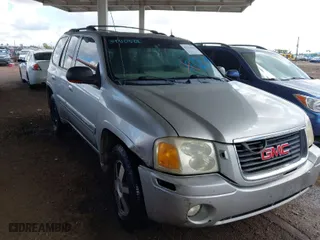 2004 GMC Envoy SLT with VIN 1GKDS13S942267554, listed as a IAAI auction lot 41754066 with 178,895 mi miles. Bid and sale history available at carsss.com. Image 1.