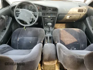 1992 Nissan Maxima z VIN JN1HJ01F1NT007180, wystawiony jako Copart lot #71271334 z przebiegiem 252 299 mil mil oraz Tytuł czysty. Historia ofert i sprzedaży dostępna na DreamBid. Obrazek 8.
