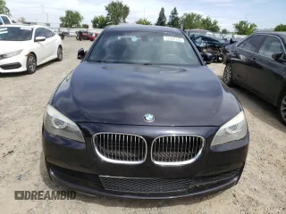 2012 BMW 7 Series 740Li with VIN WBAKB4C5XCC576227, listed as a Copart auction lot 52946135 with 154,611 mi miles and Salvage Title. Bid and sale history available at carsss.com. Image 5.