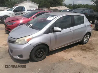 2012 Toyota Yaris L with VIN JTDKTUD35CD531056, listed as a IAAI auction lot 42169341 with 114,955 mi miles. Bid and sale history available at carsss.com. Image 2.