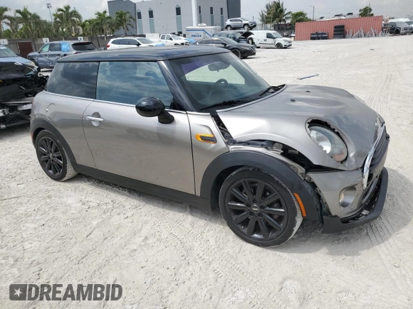 2018 MINI Hardtop Cooper with VIN WMWXP5C56J2H29012, listed as a Copart auction lot 50571595 with 77,129 mi miles and Salvage title. Bid and sale history available at DreamBid. Image 4.