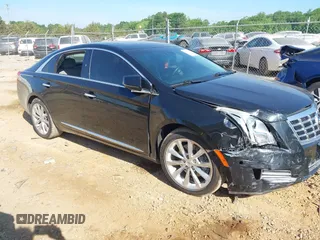 2014 Cadillac XTS Luxury z VIN 2G61M5S30E9229758, wystawiony jako IAAI lot #42179952 z przebiegiem 125 848 mil mil oraz . Historia ofert i sprzedaży dostępna na DreamBid. Obrazek 1.