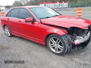 2014 Mercedes-Benz C with VIN WDDGF4HB1EA945105, listed as a IAAI auction lot 42001518 with 84,941 mi miles. Bid and sale history available at carsss.com. Image 1.