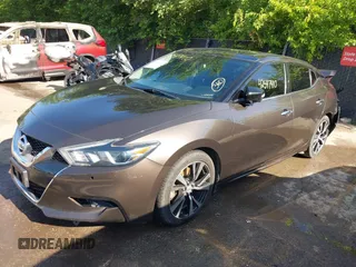 2016 Nissan Maxima Platinum z VIN 1N4AA6AP3GC385276, wystawiony jako IAAI lot #42547410 z przebiegiem 100 307 mil mil oraz . Historia ofert i sprzedaży dostępna na DreamBid. Obrazek 18.