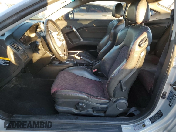 2005 Hyundai Tiburon GT z VIN KMHHN65F05U171038, wystawiony jako Copart lot #87765735 z przebiegiem 113 129 mil mil oraz Szkoda całkowita • Salvage title. Historia ofert i sprzedaży dostępna na DreamBid. Obrazek 7.