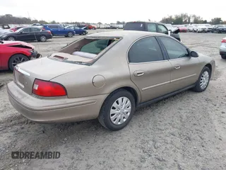 2003 Mercury Sable GS z VIN 1MEFM50U33A606937, wystawiony jako IAAI lot #41058899 z przebiegiem 138 479 mil mil oraz . Historia ofert i sprzedaży dostępna na DreamBid. Obrazek 4.