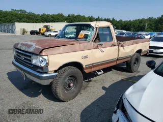 1990 Ford F-250 with VIN 2FTHF26H4LCA00395, listed as a Copart auction lot 60321695 with 50,927 mi miles and Salvage title. Bid and sale history available at DreamBid. Image 1.