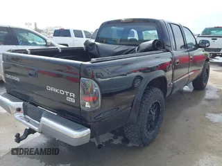 2004 Dodge Dakota SLT with VIN 1D7HL48N04S654059, listed as a IAAI auction lot 41811540 with 165,615 mi miles. Bid and sale history available at carsss.com. Image 4.