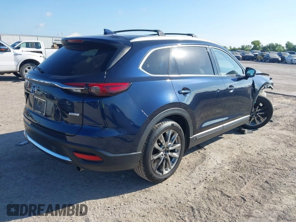 2016 Mazda CX-9 Grand Touring with VIN JM3TCADY6G0107064, listed as a IAAI auction lot 42580485 with 124,713 mi miles and . Bid and sale history available at DreamBid. Image 4.