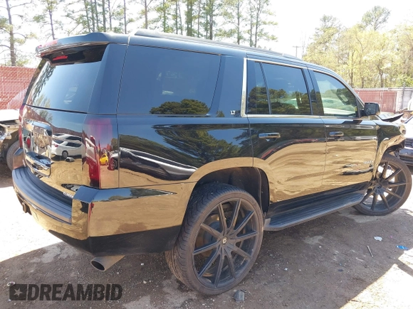 2020 Chevrolet Tahoe LT with VIN 1GNSKBKC7LR159742, listed as a IAAI auction lot 41854694 with 112,087 mi miles and . Bid and sale history available at DreamBid. Image 4.