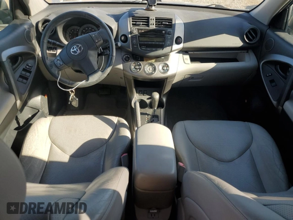 2010 Toyota RAV4 Limited with VIN JTMYK4DV1AD003591, listed as a Copart auction lot 61499555 with 100,940 mi miles and Salvage title. Bid and sale history available at DreamBid. Image 8.