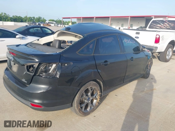 2013 Ford Focus SE z VIN 1FADP3F20DL361861, wystawiony jako IAAI lot #42652227 z przebiegiem 104 502 mil mil oraz . Historia ofert i sprzedaży dostępna na DreamBid. Obrazek 4.