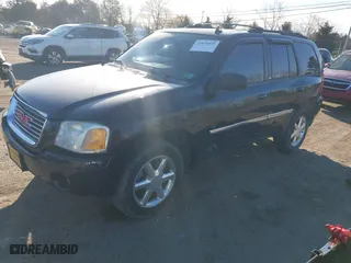 2009 GMC Envoy SLT with VIN 1GKDT43S792132160, listed as a IAAI auction lot 41876839 with 203,236 mi miles. Bid and sale history available at carsss.com. Image 2.