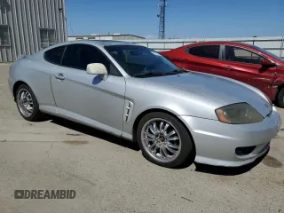 2006 Hyundai Tiburon GT z VIN KMHHN65F26U225506, wystawiony jako Copart lot #56997285 z przebiegiem 170 175 mil mil oraz Szkody całkowita. Historia ofert i sprzedaży dostępna na DreamBid. Obrazek 4.