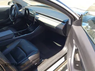 2019 Tesla Model 3 Mid Range with VIN 5YJ3E1EA3KF325056, listed as a IAAI auction lot 41771543 with 183,157 mi miles and . Bid and sale history available at carsss.com. Image 5.