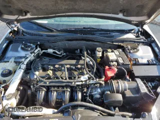 2012 Ford Fusion SE z VIN 3FAHP0HA0CR437115, wystawiony jako Copart lot #56583495 z przebiegiem 159 649 mil mil oraz Szkoda całkowita • Salvage title. Historia ofert i sprzedaży dostępna na DreamBid. Obrazek 11.