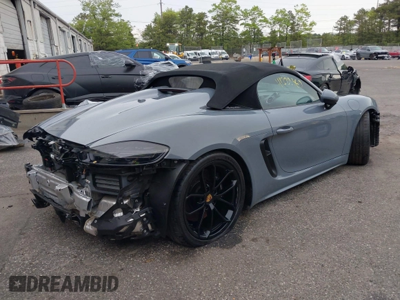 2023 Porsche 718 Spyder with VIN WP0CC2A83PS222034, listed as a IAAI auction lot 41222380 with 5,932 mi miles and . Bid and sale history available at DreamBid. Image 4.