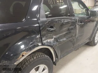 2010 Mercury Mariner with VIN 4M2CN9BG0AKJ06493, listed as a IAAI auction lot 41199173 with 143,631 mi miles. Bid and sale history available at carsss.com. Image 6.