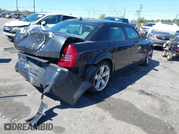 2005 Chrysler 300 with VIN 2C3AA63HX5H649107, listed as a IAAI auction lot 41748562 with 173,803 mi miles. Bid and sale history available at carsss.com. Image 4.