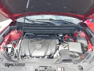 2021 Mazda CX-5 Grand Touring with VIN JM3KFADM6M1373111, listed as a IAAI auction lot 42784431 with 14,374 mi miles and . Bid and sale history available at DreamBid. Image 10.