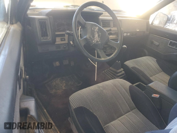 1989 Nissan Hardbody z VIN 1N6HD16S3KC401756, wystawiony jako Copart lot #46811635 z przebiegiem 78 698 mil mil oraz Szkoda całkowita • Salvage title. Historia ofert i sprzedaży dostępna na DreamBid. Obrazek 8.