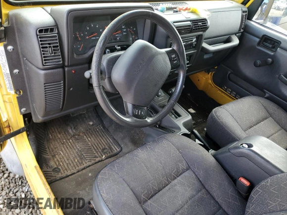 2001 Jeep Wrangler Sport z VIN 1J4FA49S01P355451, wystawiony jako Copart lot #56501545 z przebiegiem 213 027 mil mil oraz Czysty tytuł • Clean title. Historia ofert i sprzedaży dostępna na DreamBid. Obrazek 8.