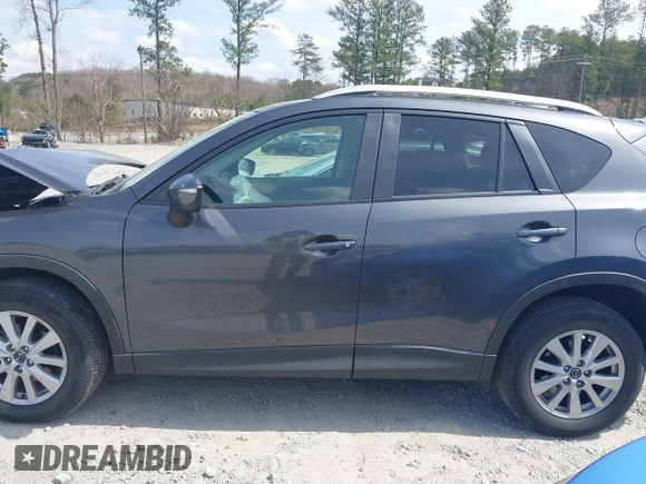 2015 Mazda CX-5 Touring with VIN JM3KE2CY2F0530204, listed as a IAAI auction lot 41788921 with 50,827 mi miles. Bid and sale history available at carsss.com. Image 14.