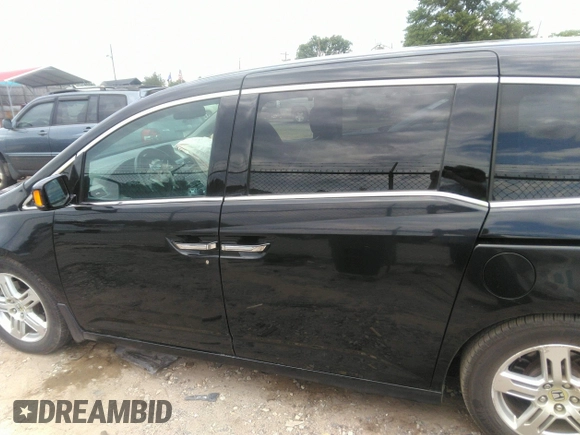 2012 Honda Odyssey Touring with VIN 5FNRL5H97CB066596, listed as a IAAI auction lot 42472935 with 217,182 mi miles and . Bid and sale history available at DreamBid. Image 14.