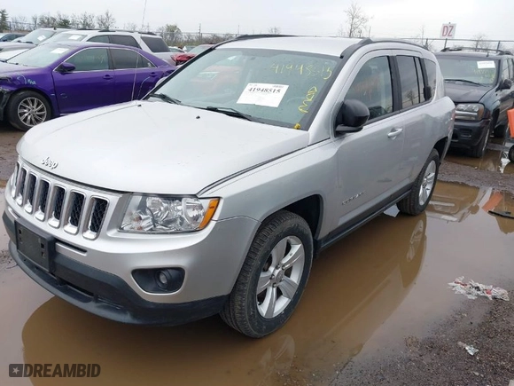 2011 Jeep Compass with VIN 1J4NF1FB6BD283741, listed as a IAAI auction lot 41948515 with 105,415 mi miles. Bid and sale history available at carsss.com. Image 2.