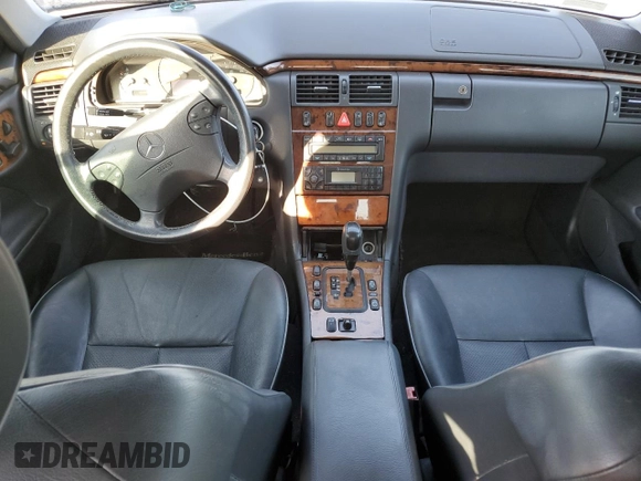 2002 Mercedes-Benz E-Class with VIN WDBJF65J02B473555, listed as a Copart auction lot 75505714 with 0 mi miles and Salvage Title. Bid and sale history available at carsss.com. Image 8.