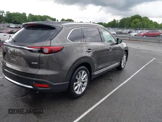 2016 Mazda CX-9 Grand Touring z VIN JM3TCADY6G0126391, wystawiony jako IAAI lot #42242541 z przebiegiem 45 147 mil mil oraz . Historia ofert i sprzedaży dostępna na DreamBid. Obrazek 4.