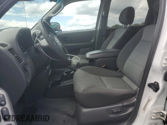 2003 Ford Escape XLT Popular 2 with VIN 1FMYU93133KD76423, listed as a Copart auction lot 57780455 with 98,779 mi miles and Salvage title. Bid and sale history available at DreamBid. Image 7.