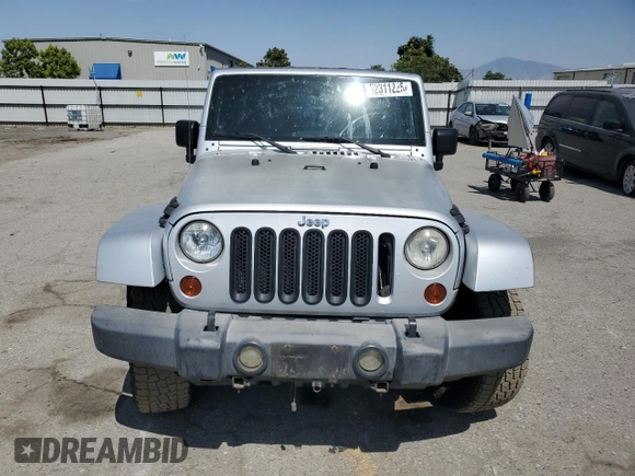 2007 Jeep Wrangler Unlimited Sahara with VIN 1J8GA59137L181360, listed as a Copart auction lot 62311225 with 151,393 mi miles and Salvage title. Bid and sale history available at DreamBid. Image 5.
