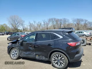 2020 Ford Escape Titanium with VIN 1FMCU9J97LUA55895, listed as a Copart auction lot 53058785 with 70,988 mi miles and Salvage title. Bid and sale history available at DreamBid. Image 2.