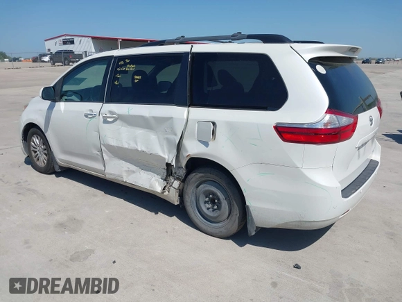 2015 Toyota Sienna XLE with VIN 5TDYK3DCXFS663083, listed as a IAAI auction lot 41967621 with 177,472 mi miles and . Bid and sale history available at DreamBid. Image 3.